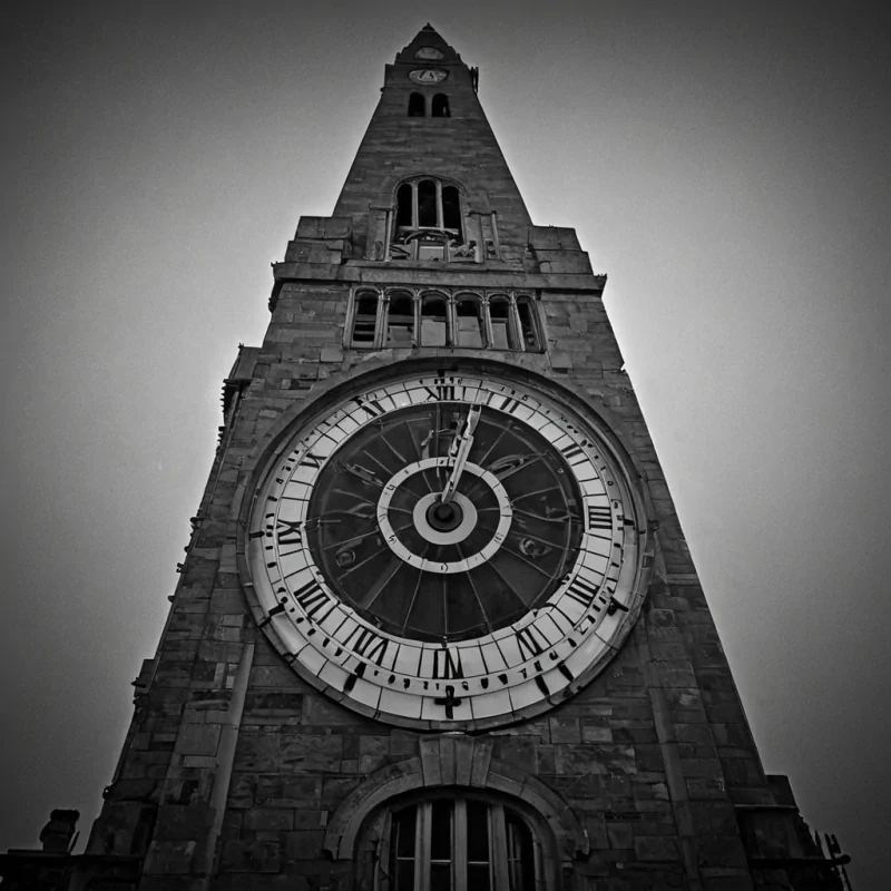 A single, selfreflecting shard of reversed time, shaped like a 1,372dimensional prismatic spiral of unformed memory and inverted chronology, hovers at the center of a vast, inverted clocktower of solidified forgettingeach gear carved from the exact moment between a second ticking and its refusal to pass, a heartbeat syncing and dissolving into nontemporal mist, a glance held and collapsing into pure, unmeasured oblivion. The shard does not reflect the pastit unreflects it, each refracting facet shedding a layer of narrative potential that never coalesced into linear experience, reforming into ephemeral, lapislazulithreaded afterimages shaped like the negative space between two hands that