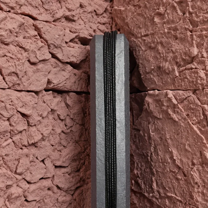 A hyperrealistic, vertical closeup of a single, massive, translucent fiberoptic cable bundle emerging from a raw, jagged fissure in a wall of compressed, dusty rose sandstone. The cables are not emitting light but are absorbing the ambient environment, rendering the background through the strands in reversed, inverted color spectra. Wrapped tightly around the center of the bundle is a strip of woven, matte black denim fabric, its weave interlocking with the delicate glass filaments in a seamless hybrid of industrial textile and hightech conduit. Tiny, hexagonal bolts made of brushed aluminum secure the denim to the stone, each bolt head reflecting a miniature, distorted version of the surrounding room. The lighting is soft and diffused, coming from behind the subject